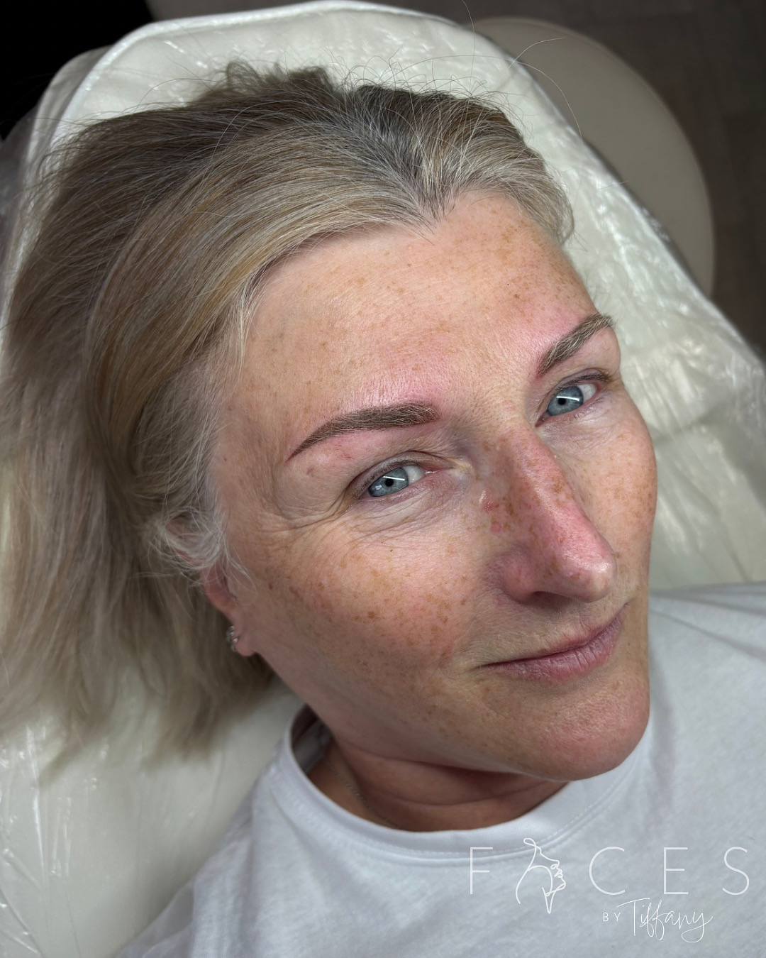 Mature client with natural eyebrow permanent makeup
