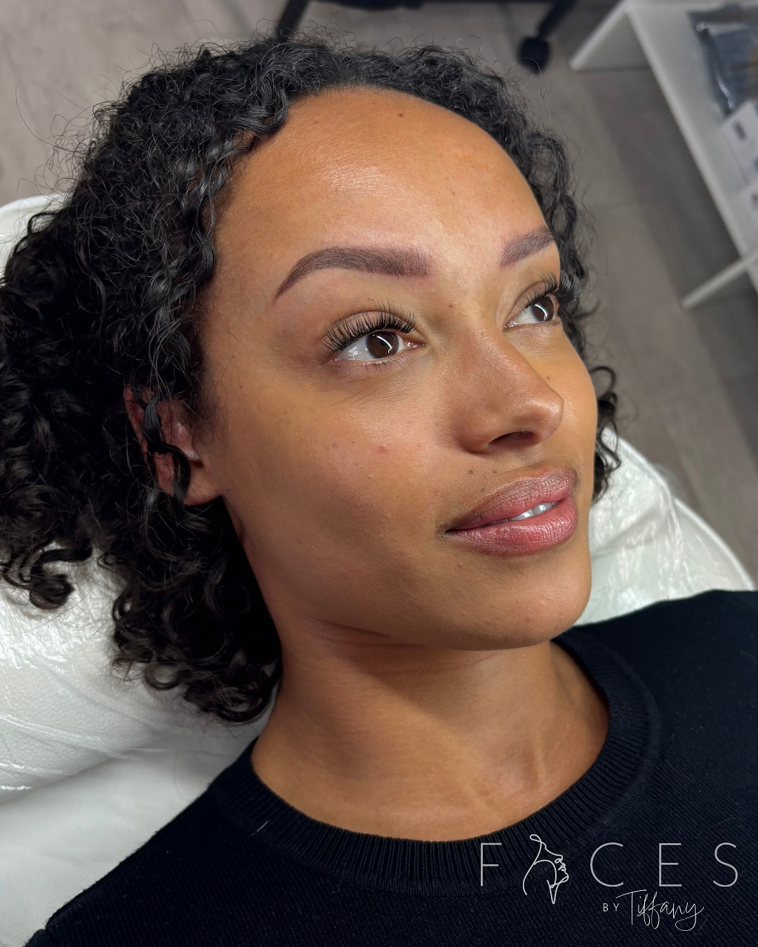 Portrait with ombré brows and lip blush on curly haired client
